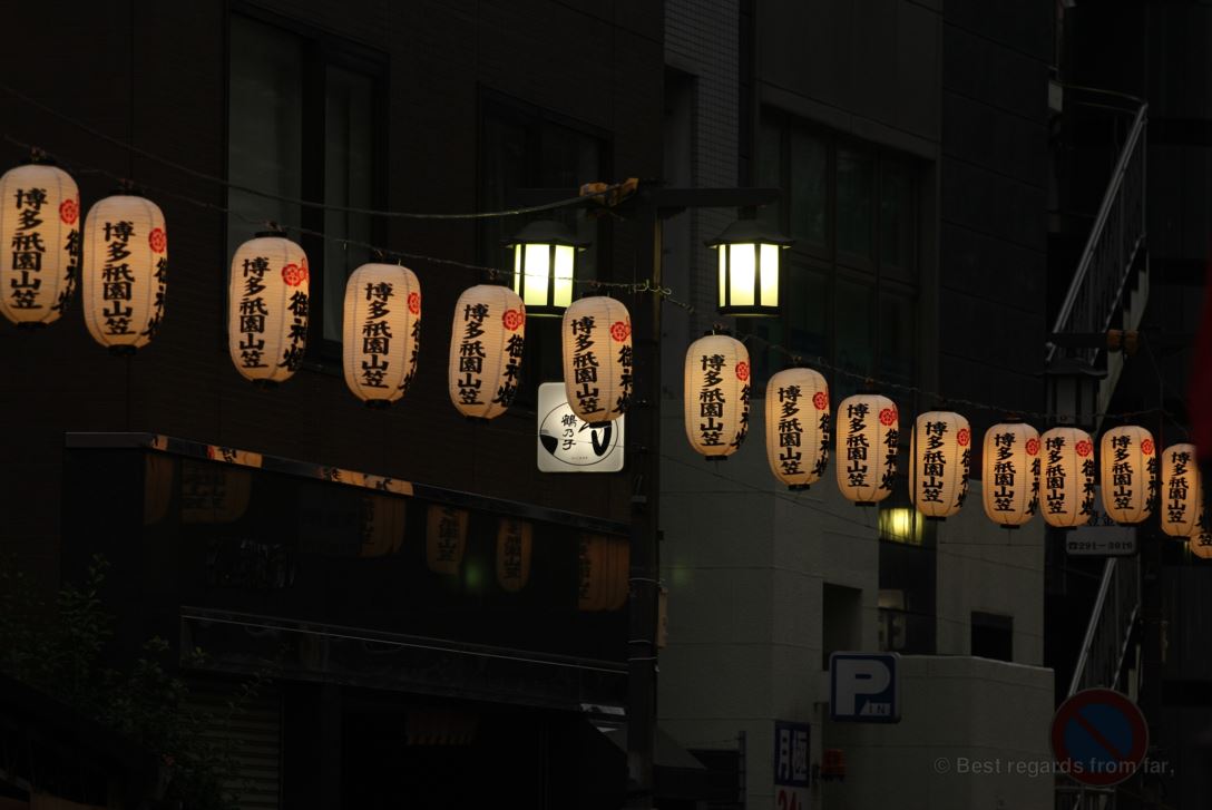 Japanese lanterns lit at dusk and paving the way to the Hakata Gion Yamakasa festival