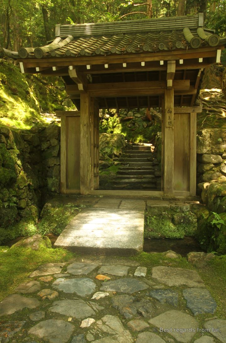 Stone path and Japanese gate leading the the Zen garden in Koke-dera, the temple of moss, Kyoto.