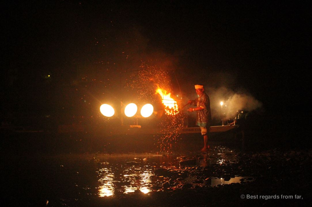 Ancient tradition of cormorants fishing (ukai) in Japan: fisherman by the bonfire by night.