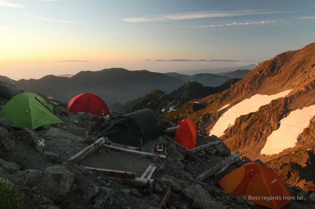 The high-altitude Yari-dake camp with colourful technical tent and our over-sized tunnel tent, while trekking the Japanese Alps.