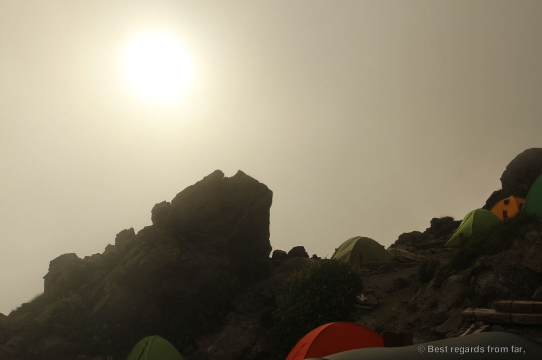 Technical and colourful mountain tents at the Yari-dake high-altitude camp while the weather gets cloudy. Hiking the Japanese Alps.