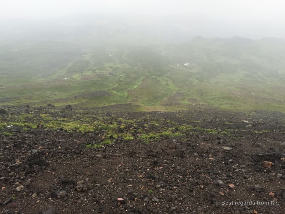 View on the Daisetsuzan Grand Traverse hiking trail covered in clouds, Hokkaido, Japan.