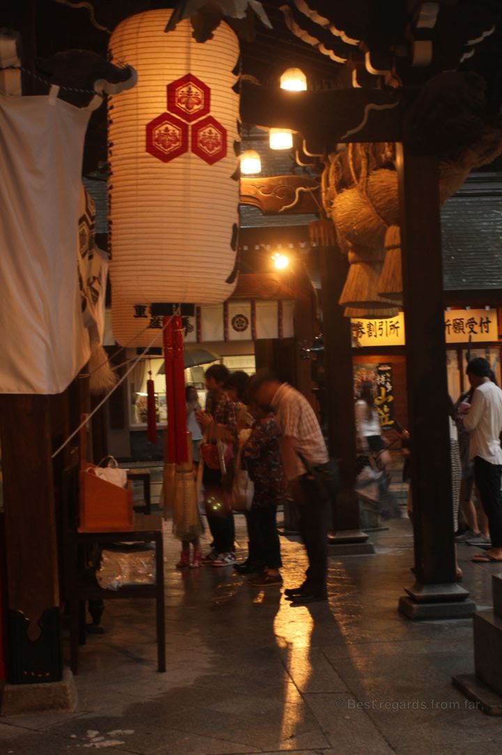 Believers praying in front of the Kushida shrine, Fukuoka.