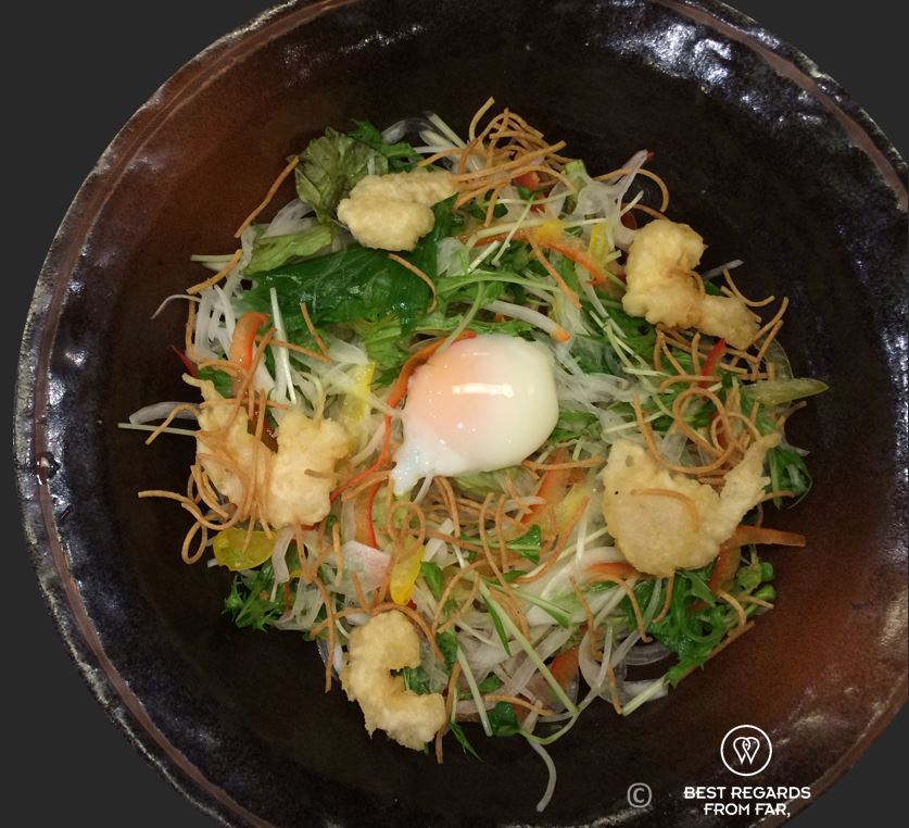 Soba noodles, Japan, served in a traditional ceramic bowl with shrimp tempura and egg