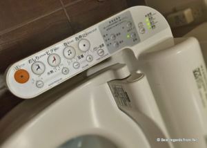 Instructions on the control panel of a Japanese toilet.