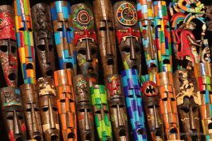 Colourful wooden masks sold by merchants in Chichén Itza, Mexico