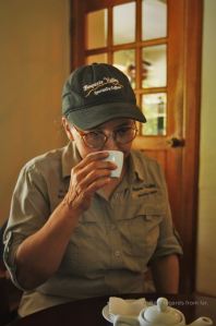 Señora Ruiz at Cafe Ruiz in Boquete in Panama tasting a cup of Geisha coffee.