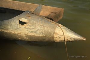 Fuel tanks recycled as bomb boats during the secret war in Laos Ban. Photo of the tip of a bomb boat on the river in Thabak, Laos.