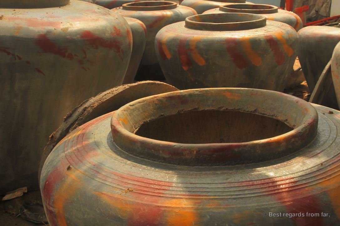 Handmade water jars drying in the sun.