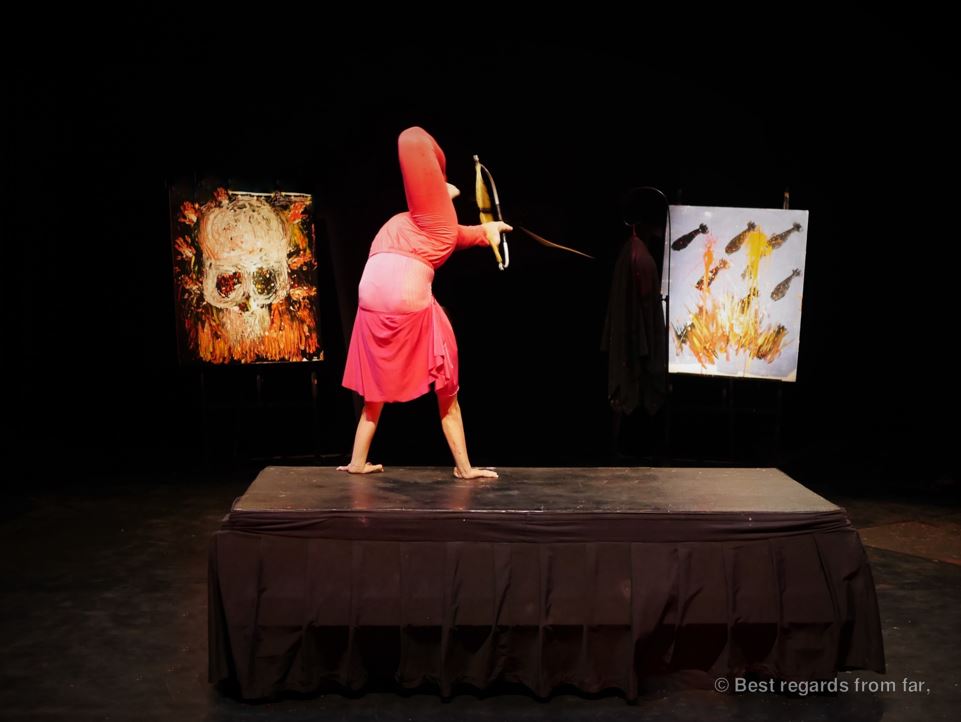 Circus artist using a bow and arrow with her feet, Phare the Cambodian Circus, Siem Reap, Cambodia.