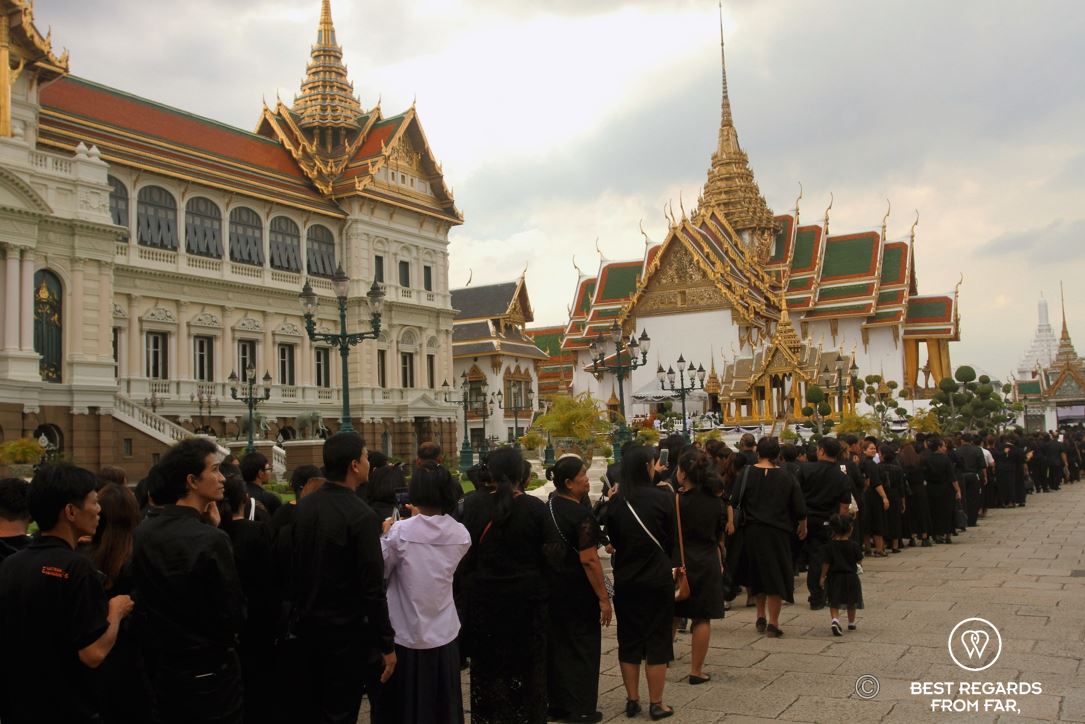 A 2016 photo of Thai people dressed in black paying a last respect to their beloved King Rama IX in the Grand Palace, Bangkok.