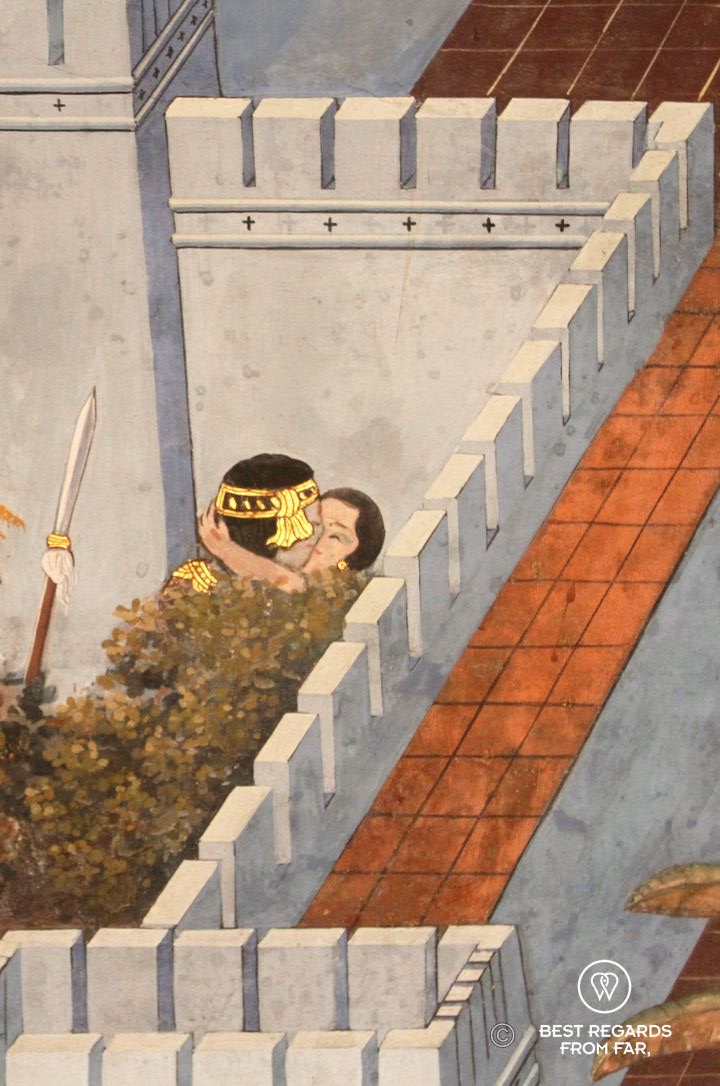 Details of a mural in the Grand Palace of Bangkok where a soldier kisses a woman.