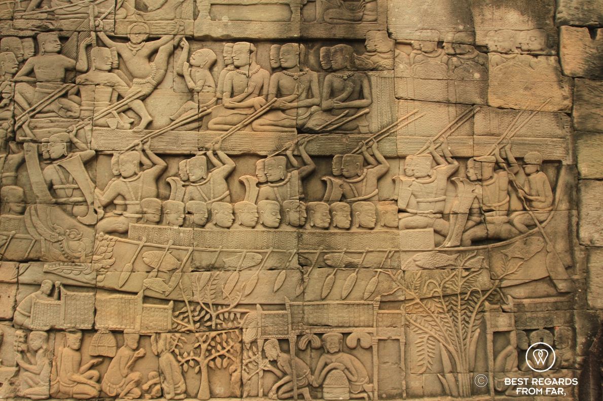 A naval battle at the top, and a market scene at the bottom of a Bayon bas relief, Angkor, Cambodia.