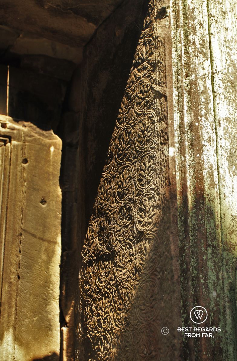 Stone-carved detail of the Ta Prohm temple at Angkor, Cambodia.