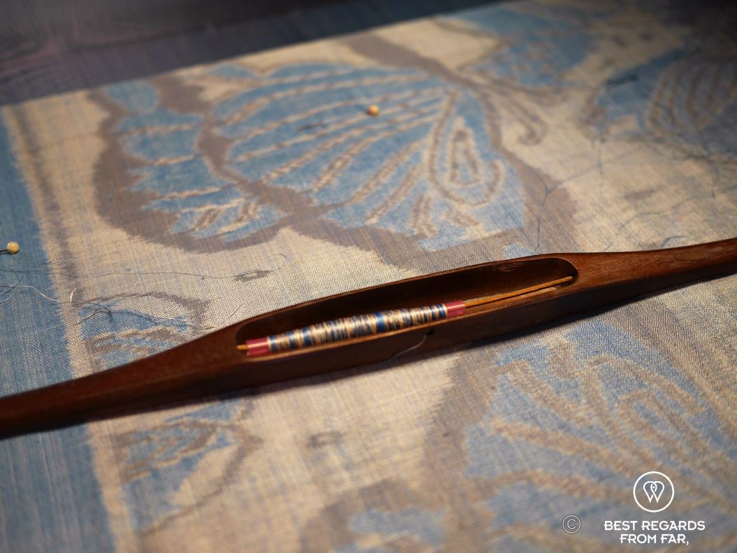 Ikat weaving technique on a previously dyed thread.