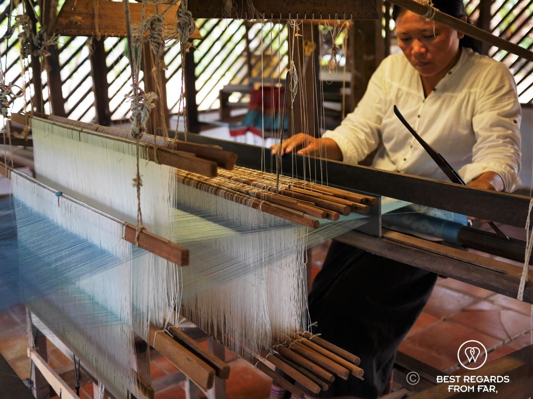 Weaving golden silk on the loom.