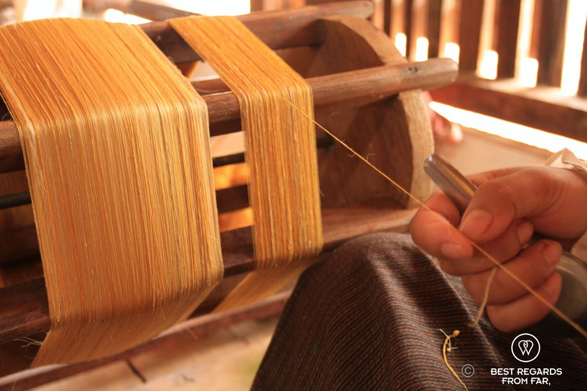 Close up of a golden silk thread.