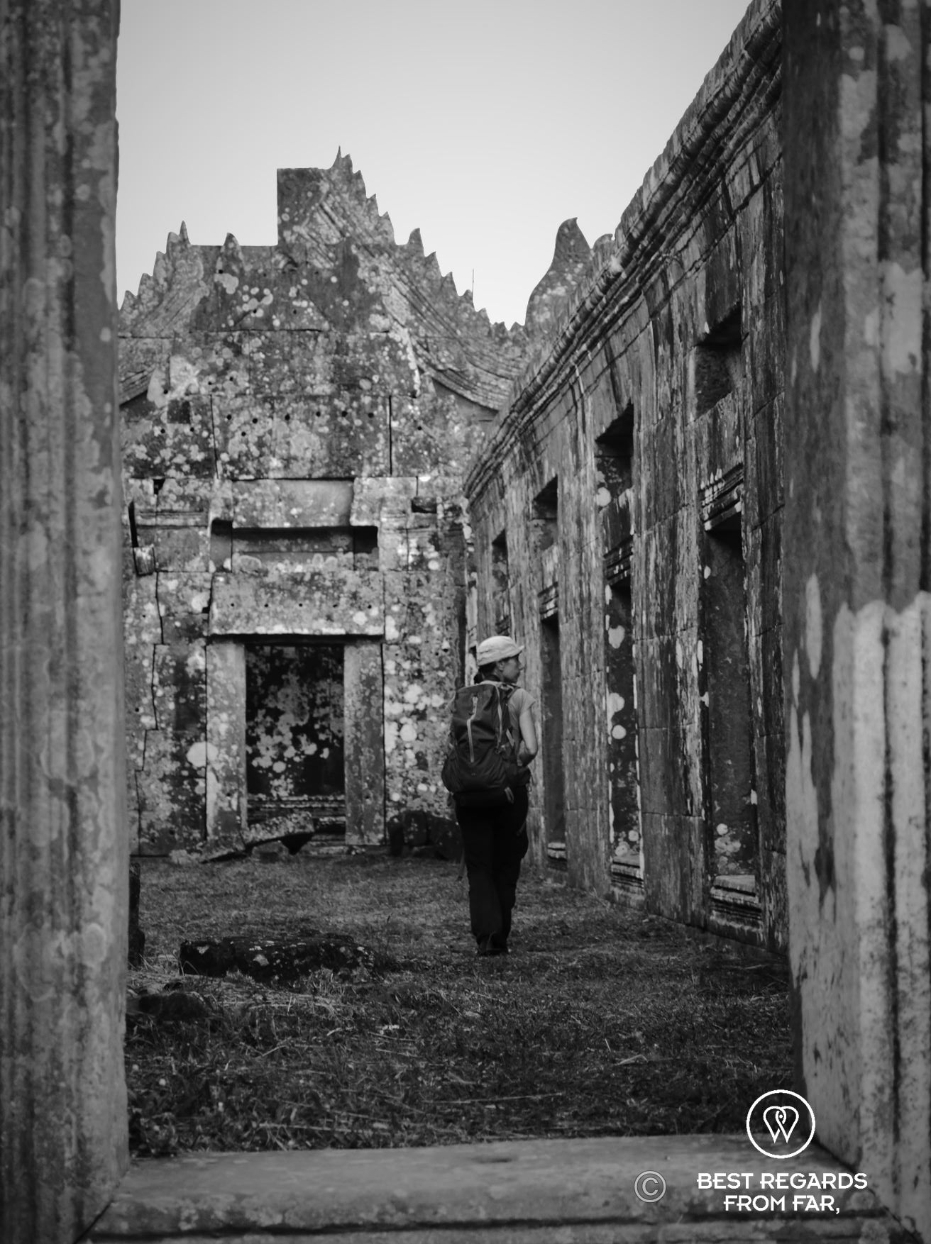 Woman taking in the ruins of the lost Preah Vihear temple.