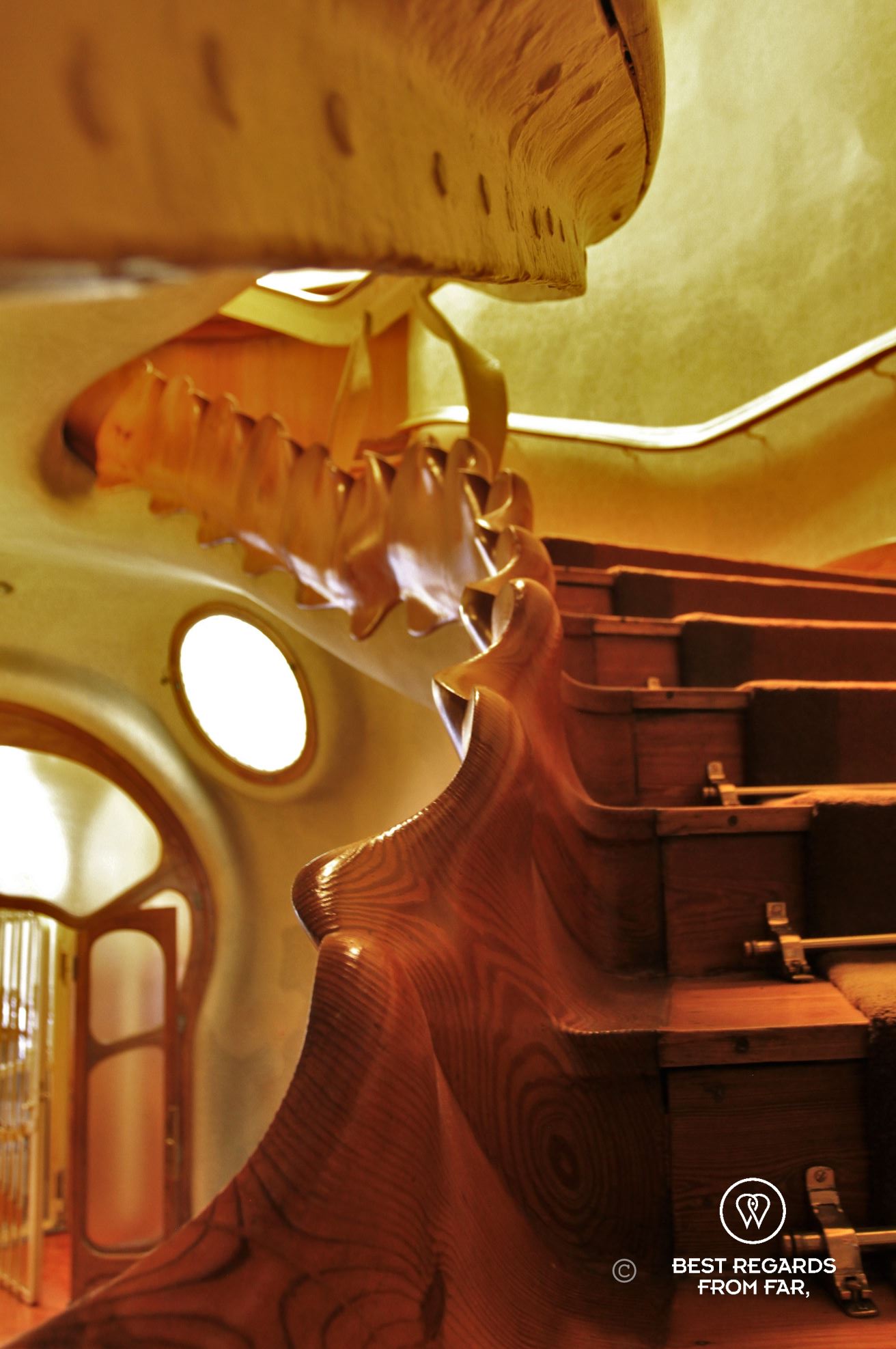 The curvy and wooden staircase by Gaudi's Casa Batllo.