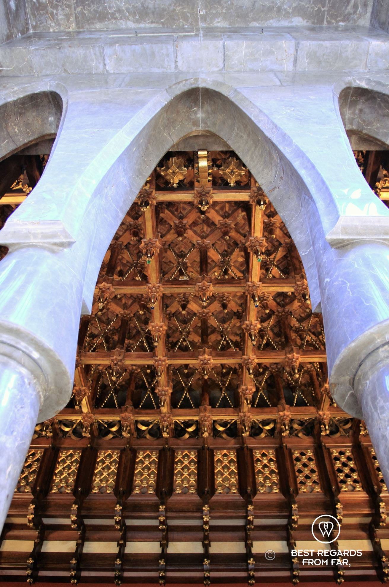 Parabolic arches and finely sculpted oak ceiling at Palau Güell in Barcelona.