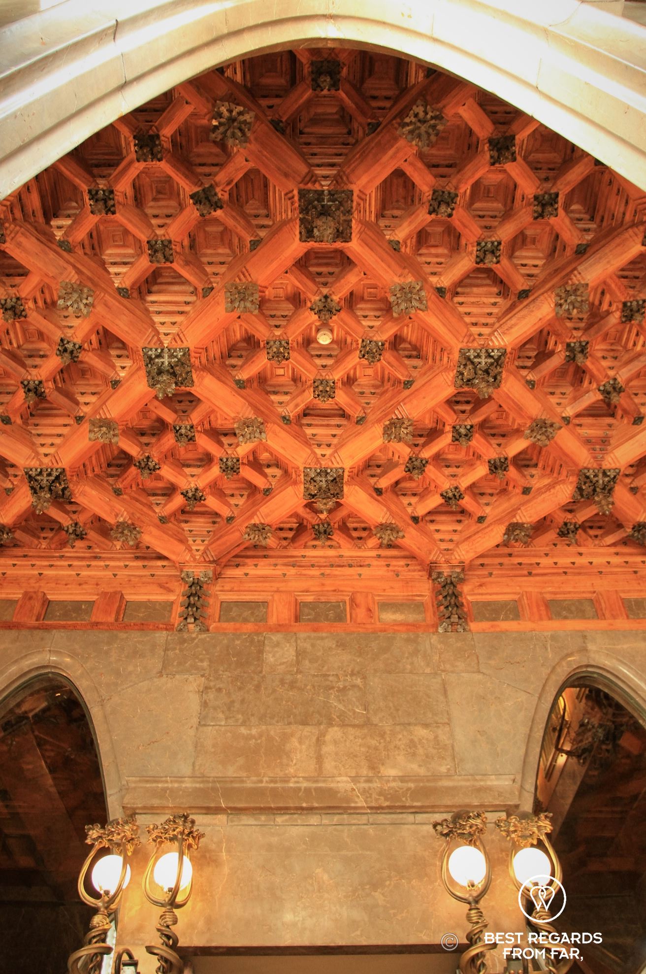 Finely sculpted oak ceiling at Palau Güell in Barcelona.