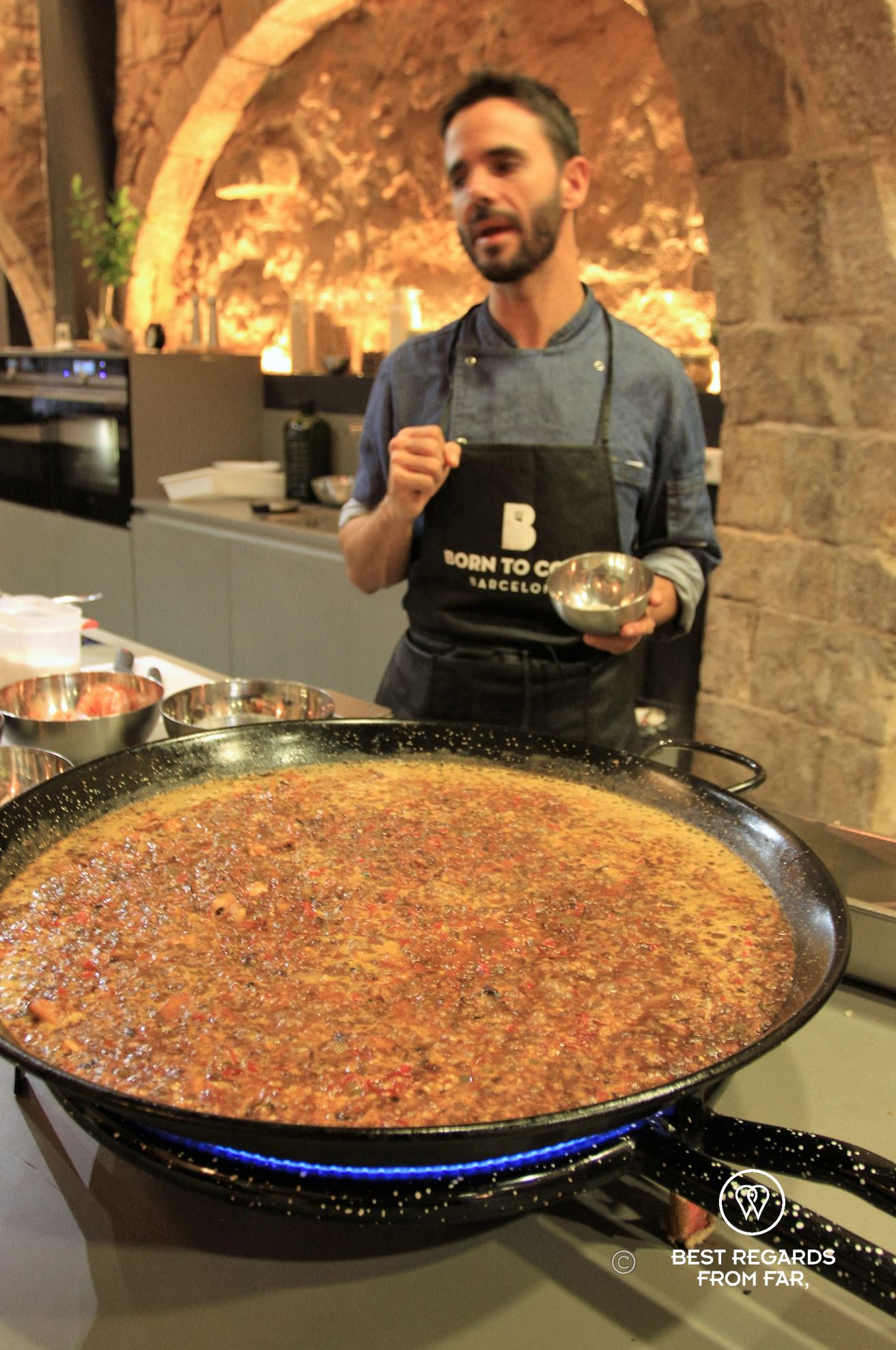 Preparing the paella at Born to cook cooking school, Barcelona.