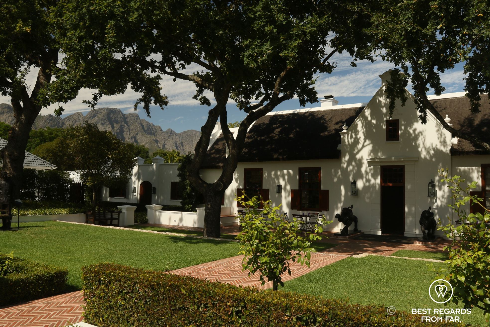 Traditional Cape Dutch estate with a thatched roof in Franschhoek, South Africa
