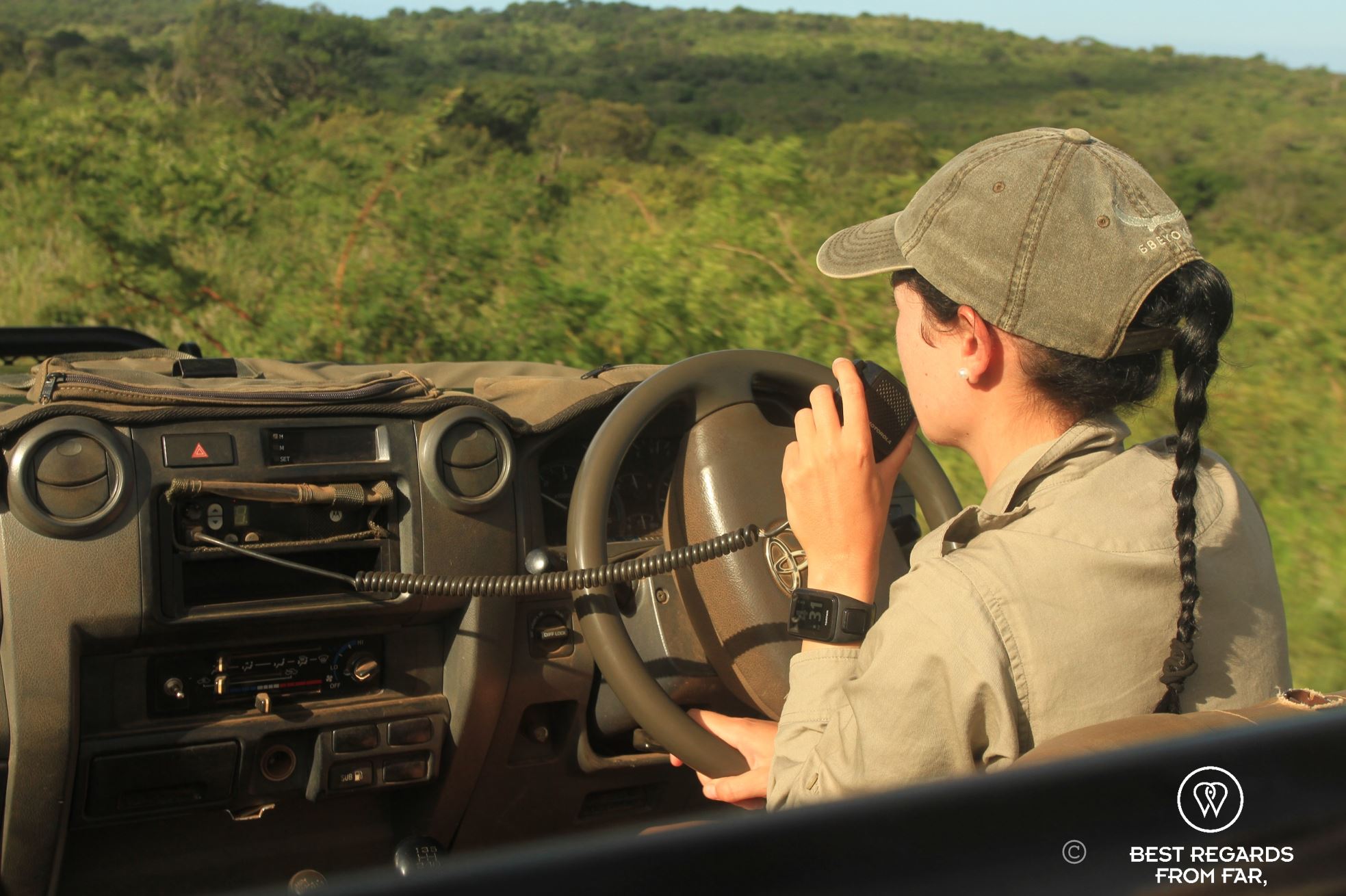 A ranger in her 4x4 in the bush at &Beyond Phinda Private Game Reserve, South Africa.