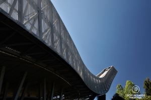 Close-up of the Holmenkollen Ski Jump on a sunny day in Oslo.