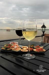 Wine and food on a sunset boat cruise on the Mekong.