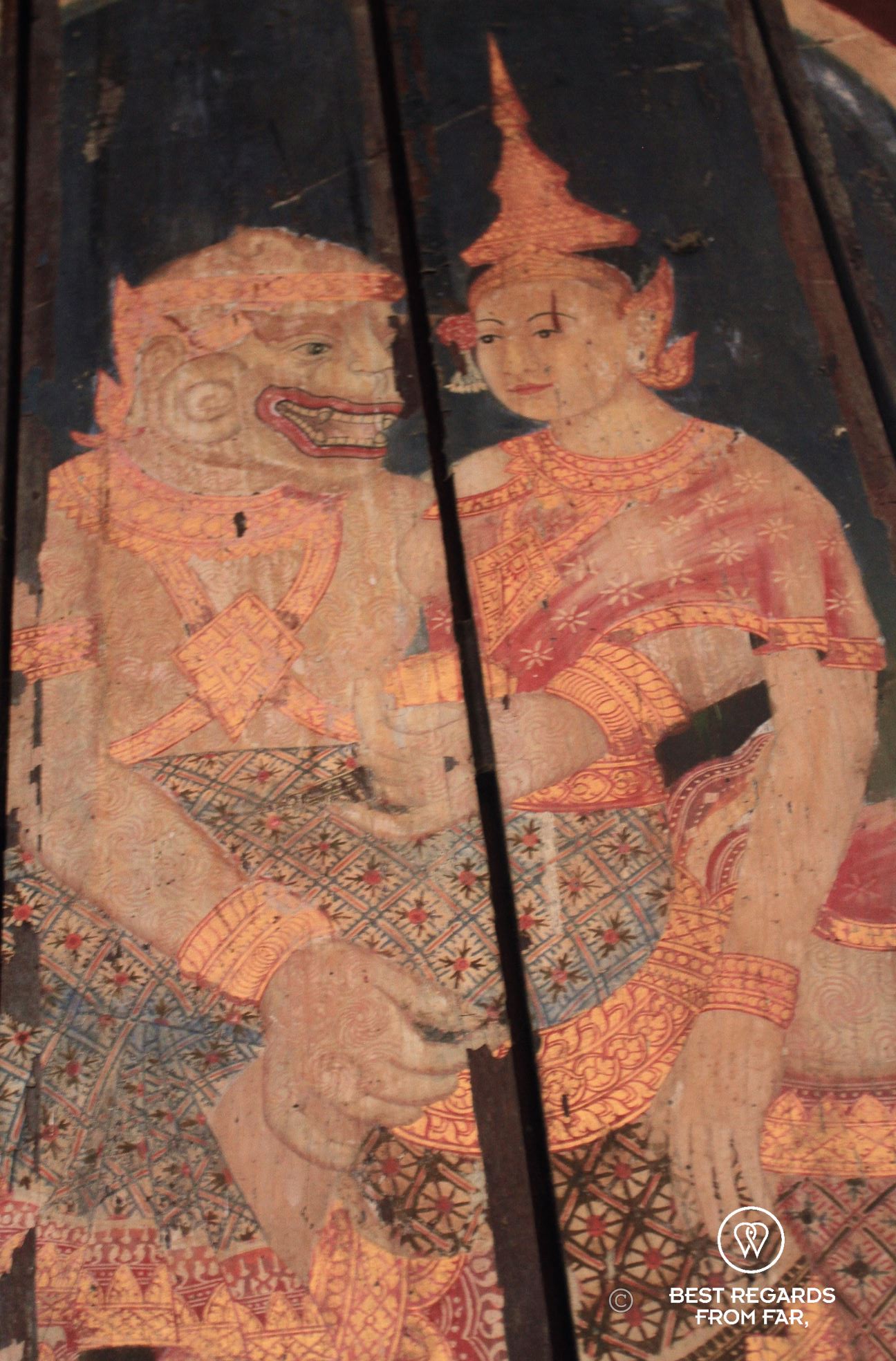 Painting on wood of an animal and person.
