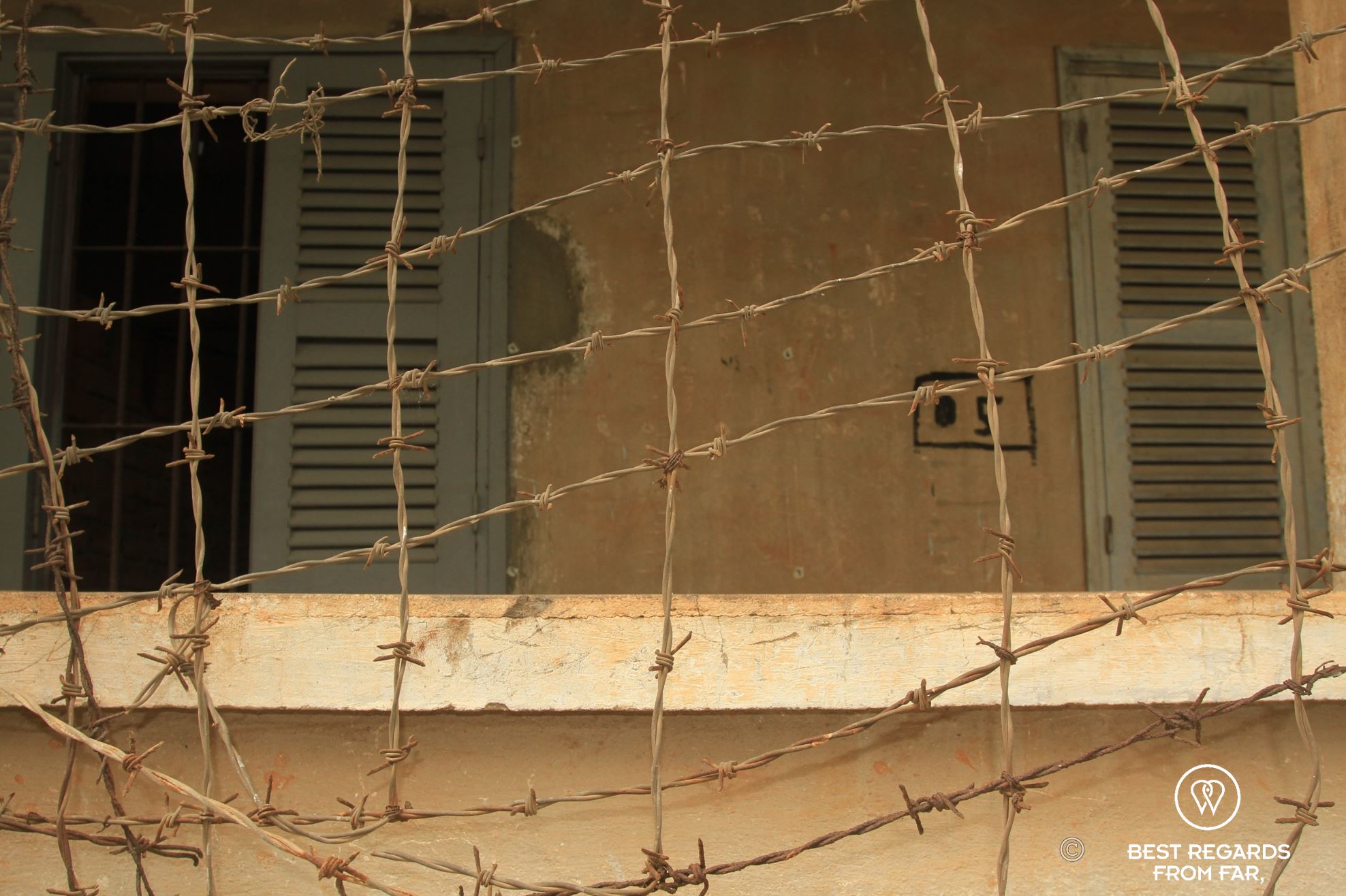 Barb wire in front of a prison used during the Cambodian genocide.