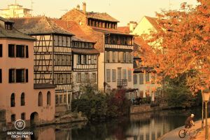 Petite France typical architecture by the canal bathed in sunset light, Strasbourg, France