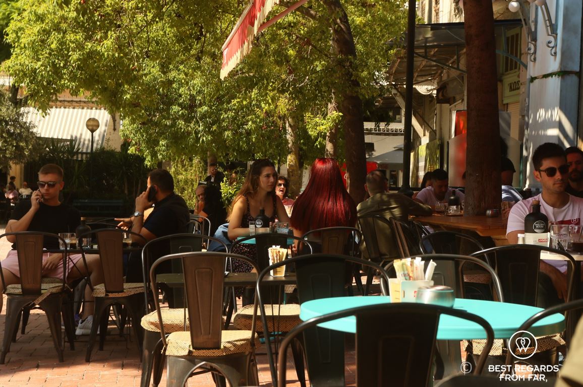 People having drinks on a sunny terrace in Athens, Greece