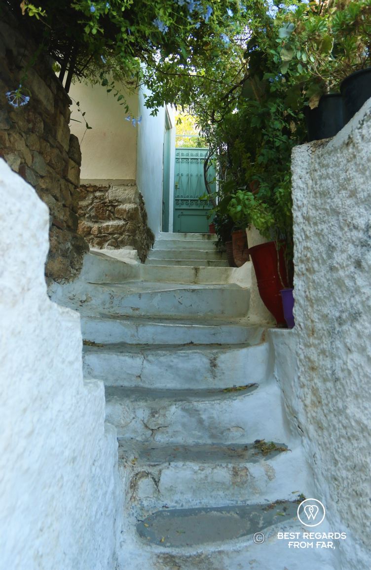 White staircase, and metal door in Anafiotika, Athens, Greece
