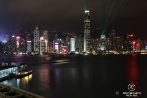 View from Cucina restaurant at night on the high-rise buildings of Hong Kong Island during the laser show, Kowloon, Hong Kong