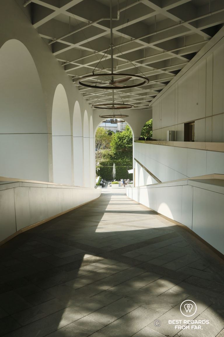 Architecture of the white and gold ramp of the landmark Murray luxurious hotel in Hong Kong