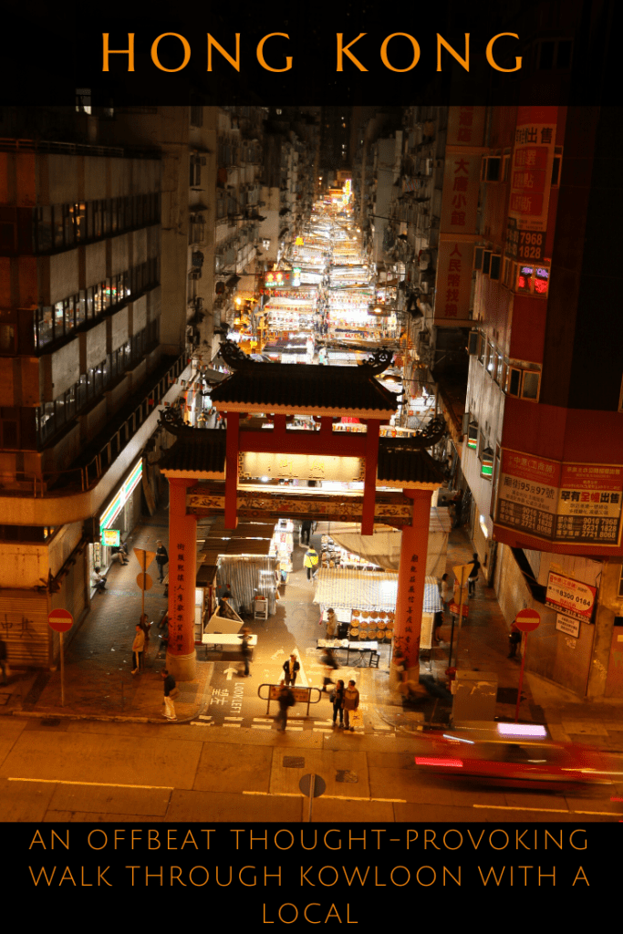 Lit market street at night in Kowloon, Hong Kong