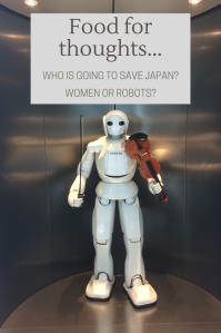 White robot with a violin in its hand in the Toyota Factory, Japan.