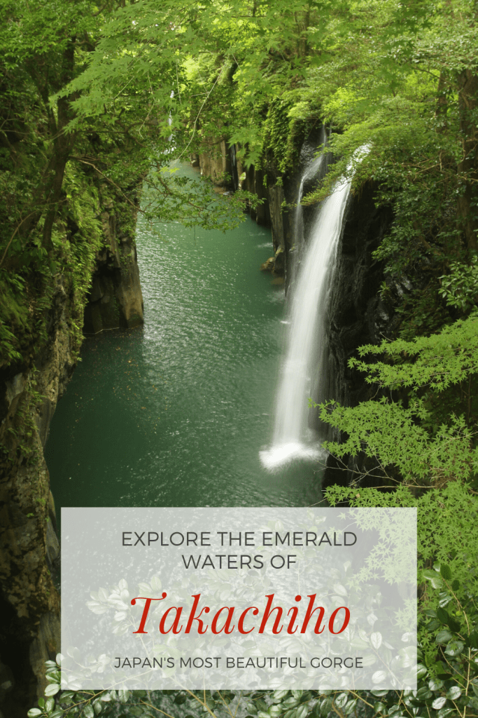 Gorge with emerald water, a waterfall and green trees in Japan.