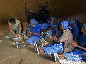 Grinding corn for flour with Basotho women in Eastern Lesotho