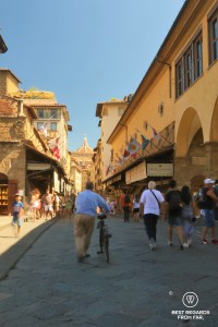 Passers by on the Ponte Vecchio in Florence, Italy.