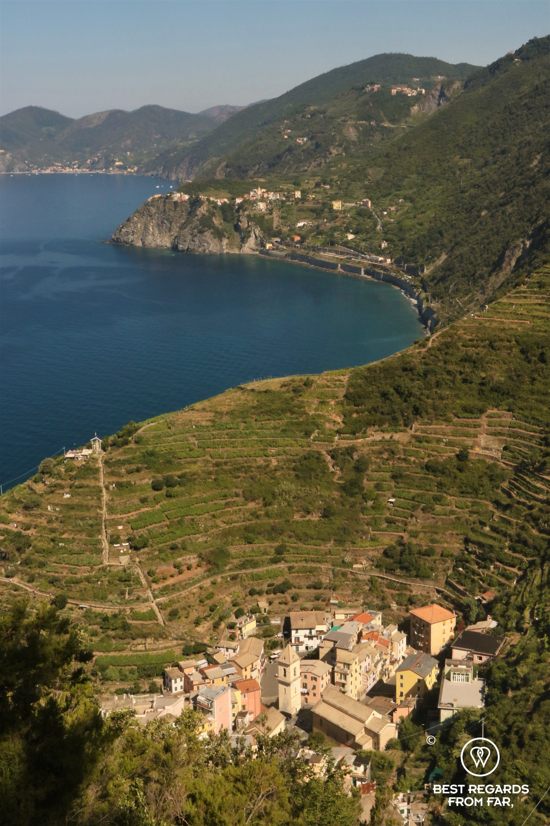 Stunning view on the sea, the amphitheater of terraced vineyards and the city of Manerola in Cinque Terre, Italy