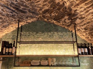 Old wine cellar with wine glasses and bottles
