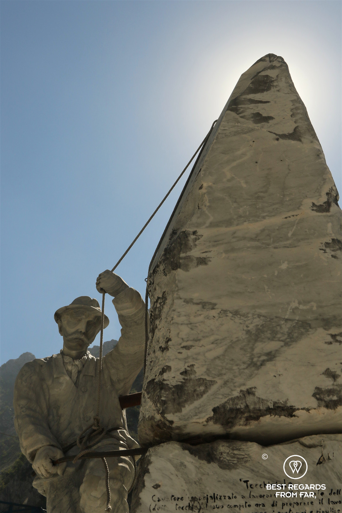 Marble statue of a marble worker in the Carrara marble quarries