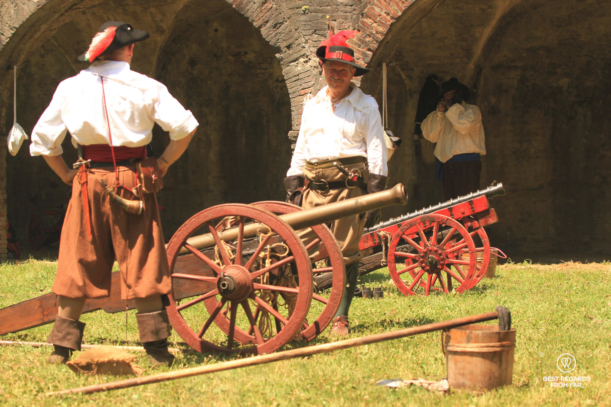 Men in period costumes firing the canons for the Saint Paolino celebrations in Lucca, Italy.