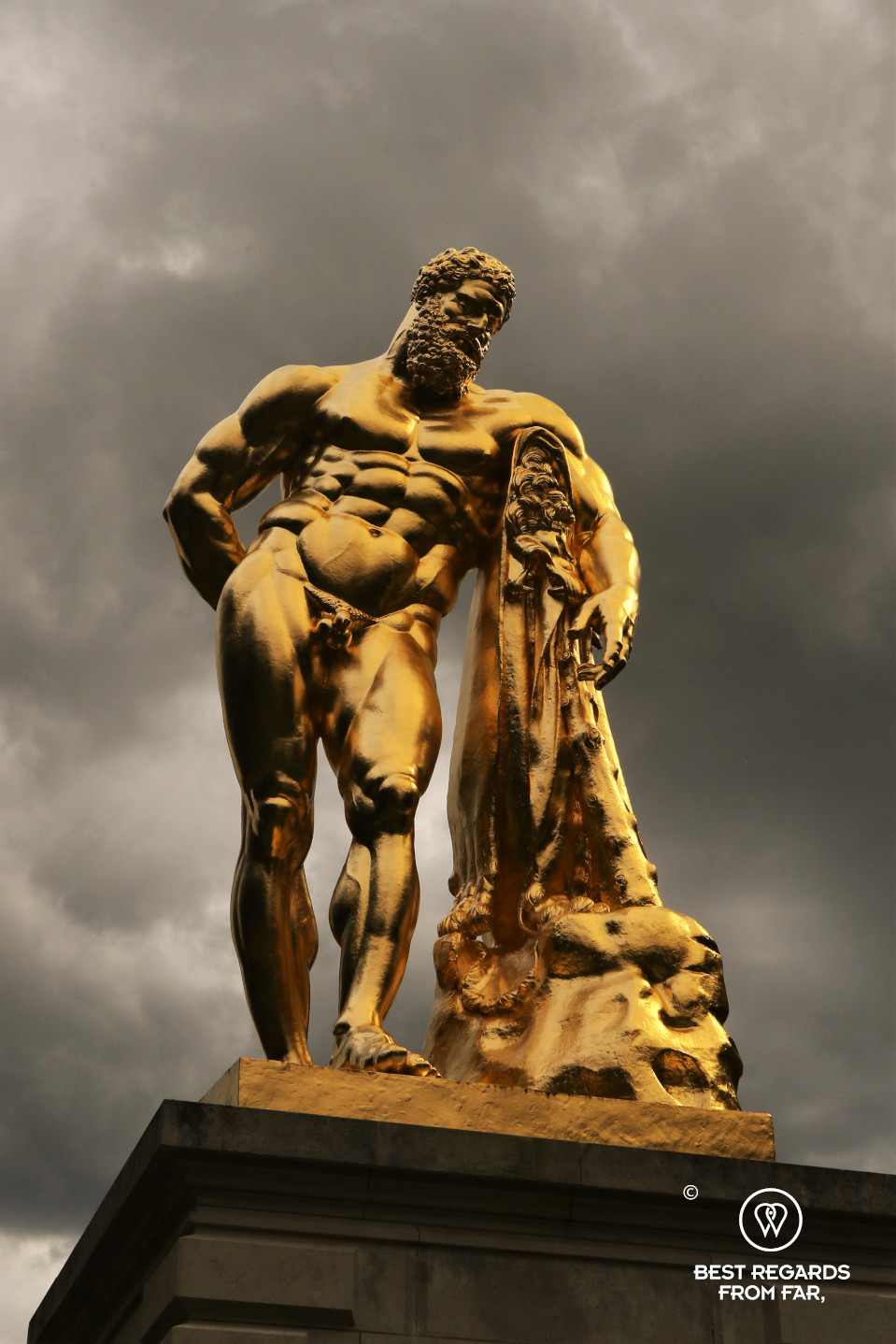 The golden sculpture of Hercule in the garden of the castle of Vaux le Vicomte, France.
