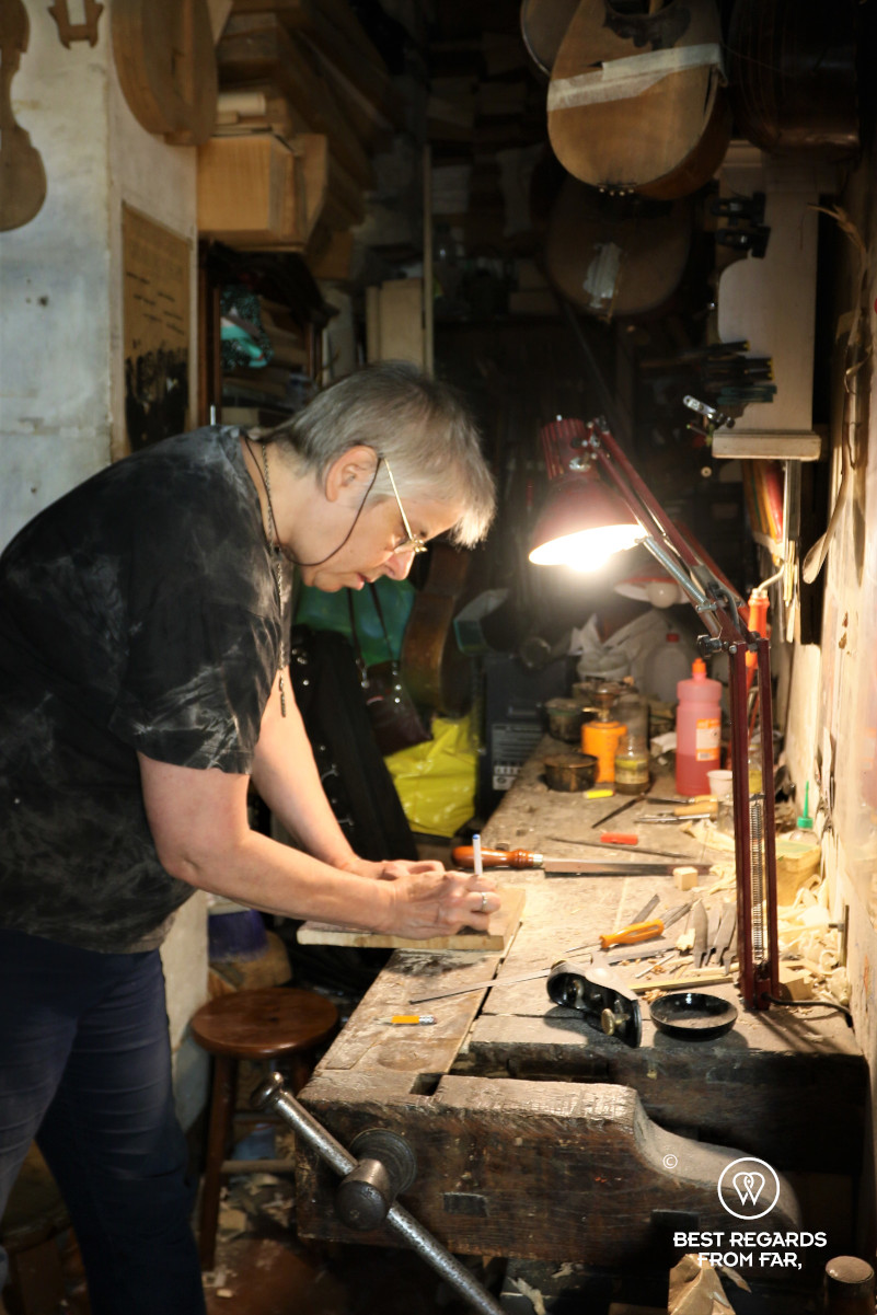 The crafts of Florence: Jamie Lazzara making a violin in her workshop.