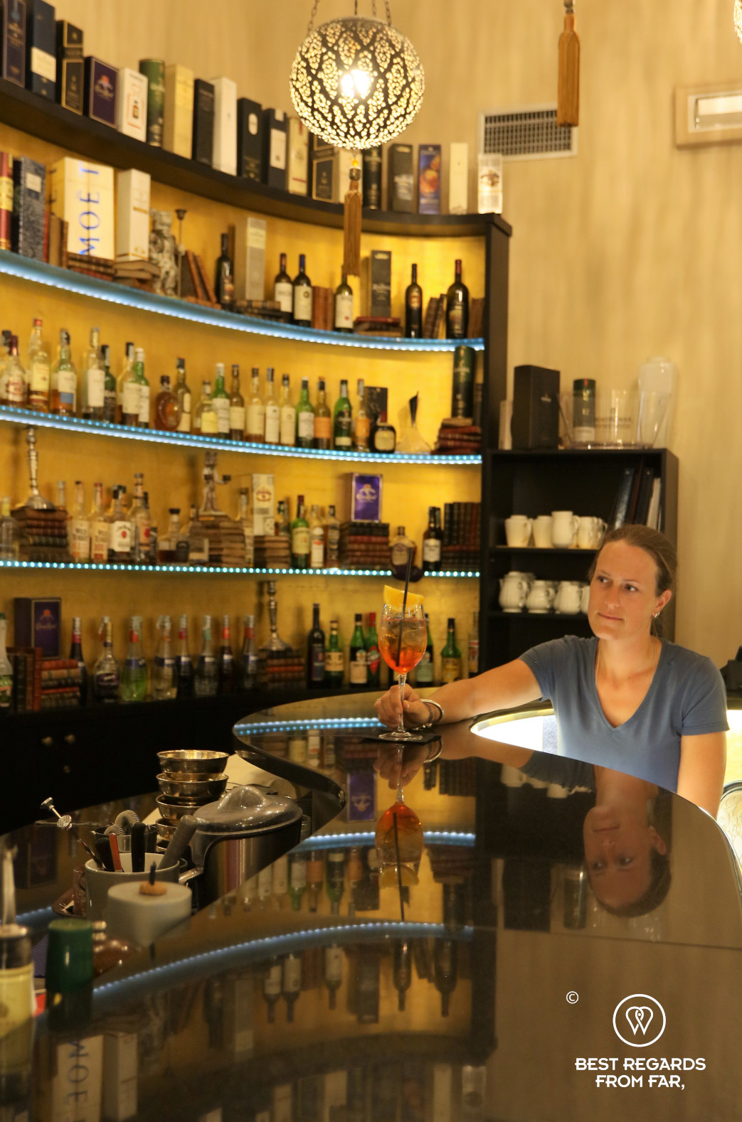 Patron having a spritz at the bar of the Hotel Bernini Palace, Florence, Italy