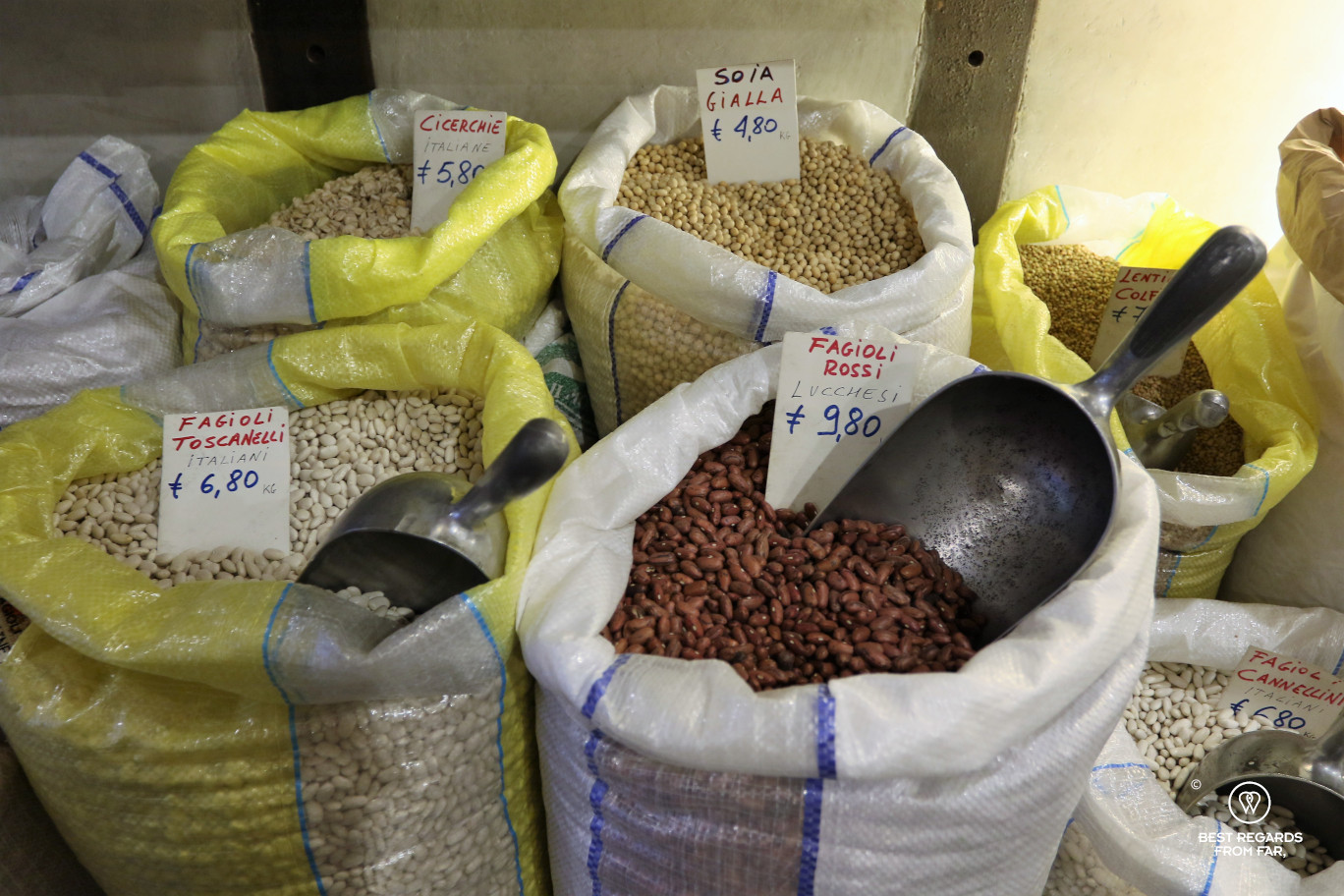 Large bags of beans in a store in Lucca